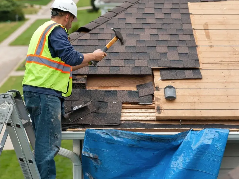 Orange Exteriors crew installing a new asphalt shingle roof on a home in Eden Prairie, MN