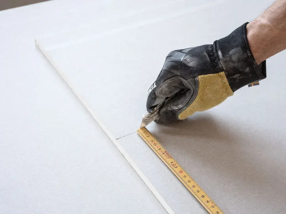Drywall finishing work inside a Minnesota home after storm damage repair