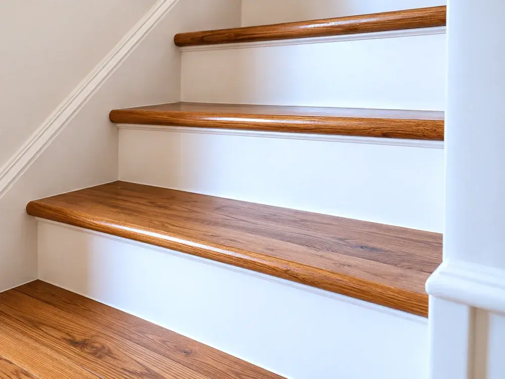 Hardwood stair treads and trim detailing in an Eden Prairie, MN home