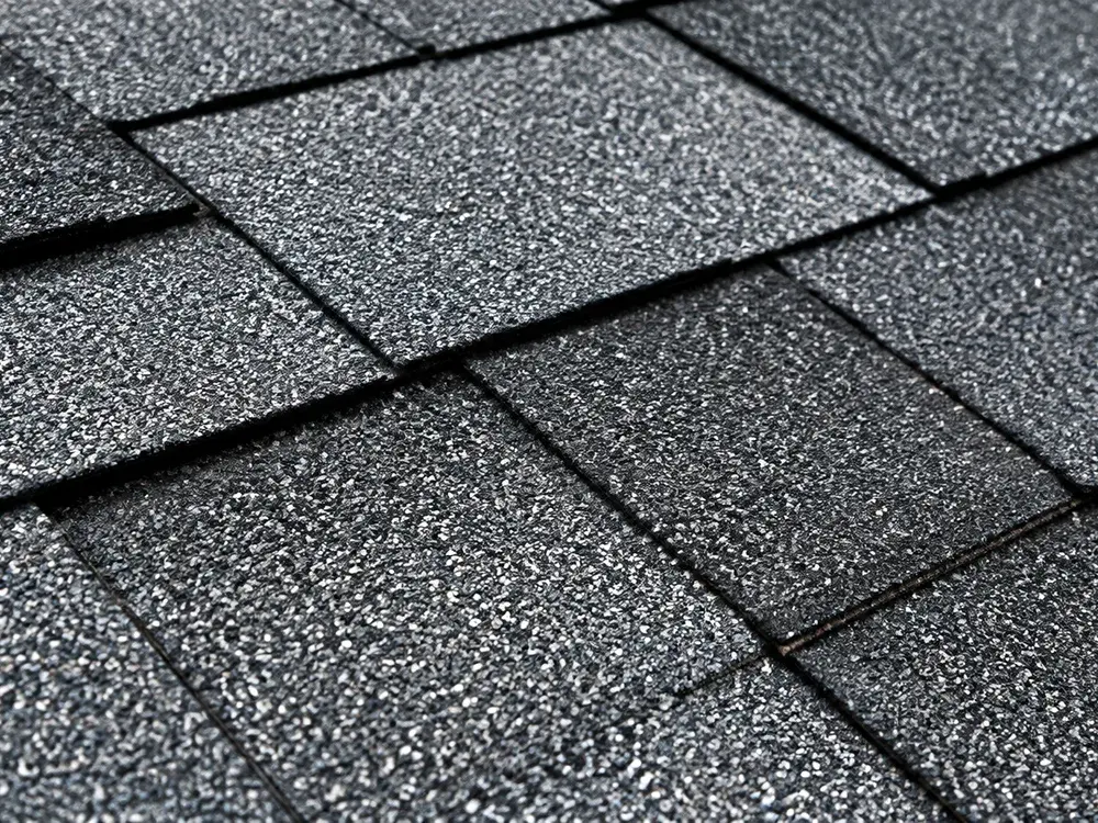 Close inspection of architectural shingle courses on a roof in Eden Prairie, MN Close inspection of architectural shingle courses on a roof in Eden Prairie, MN