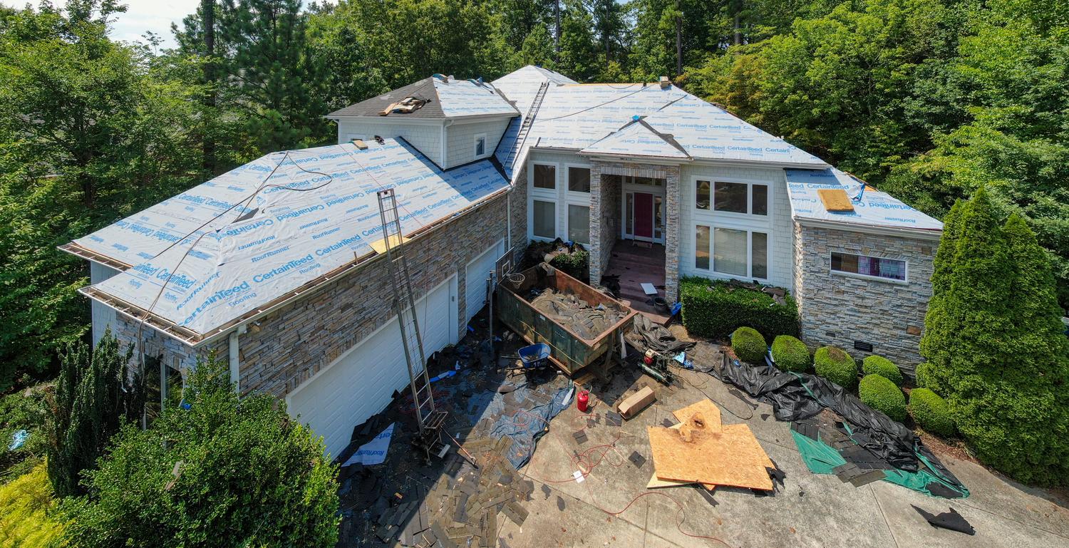Reliable Roofing Company in Norwood Young America, MN completing residential roof replacement
